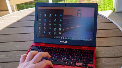 ASUS Chromebook 12 C223NA on an outdoor patio table.