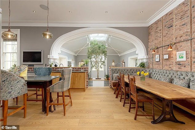 The renovated property has retained some original touches including exposed brickwork