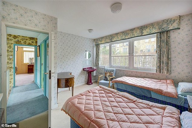 There are seven bedrooms at the property, including this one that has separate twin beds