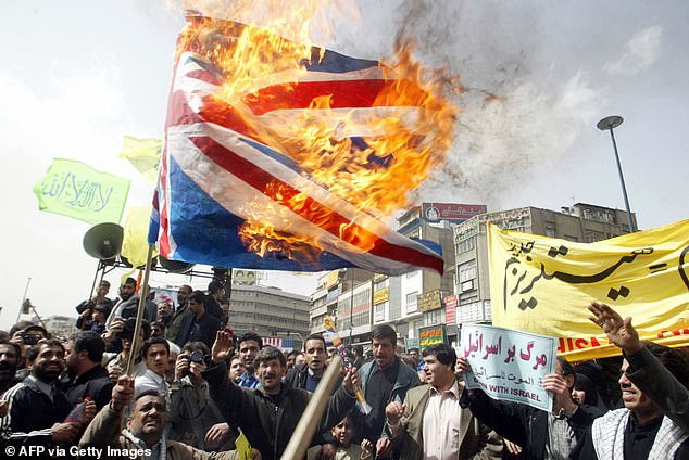 Iranian protesters burn a British flag during a demonstration against the US-led war, in Tehran in 2003