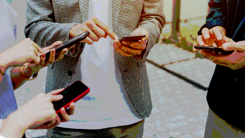 A group of people using smartphones.