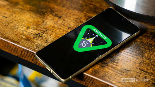 Android 15 logo on smartphone on counter stock photo (10)