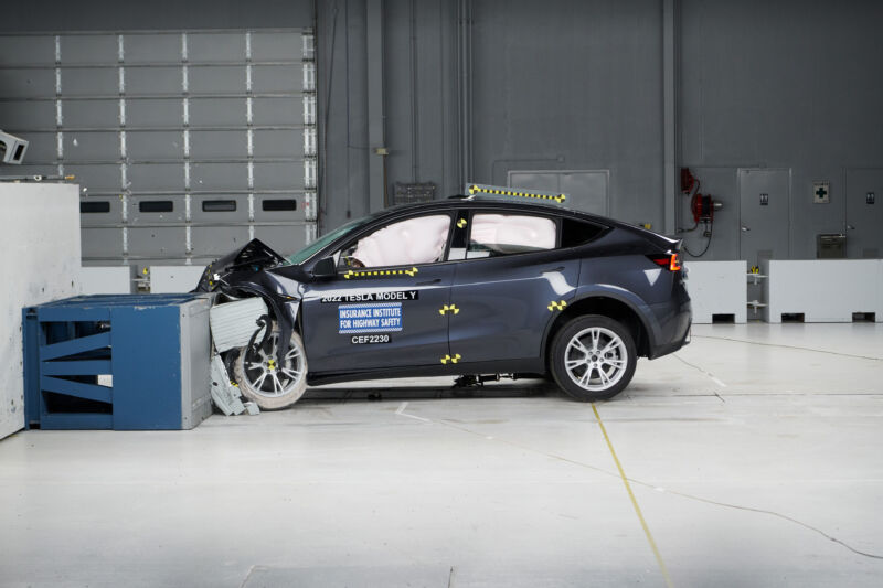 A blue tesla model y undergoes a crash test