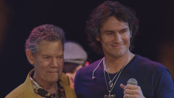 Randy Travis and Joe Nichos smile on stage during Great Performances: George Jones: Still Playin’ Possum.