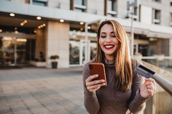 Woman smiling while online banking