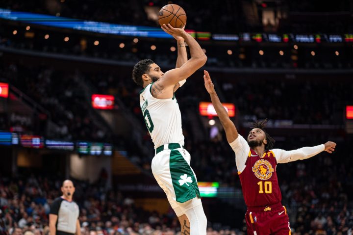 Jayson Tatum goes up for a shot in a basketball game.