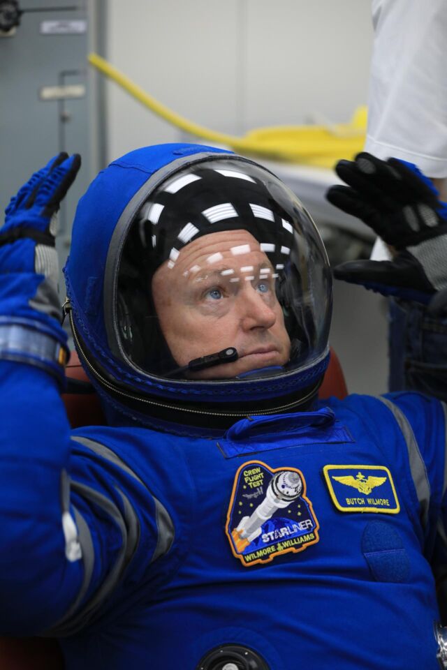 NASA astronaut Butch Wilmore, commander of the first Starliner crew flight, tries on a Boeing spacesuit during a crew validation test at NASA's Kennedy Space Center in 2022.