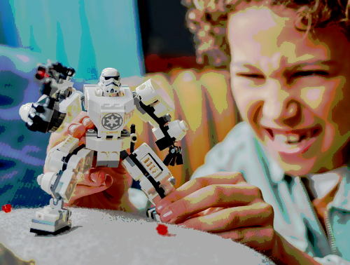 A child playing with the Stormtrooper Lego Set.