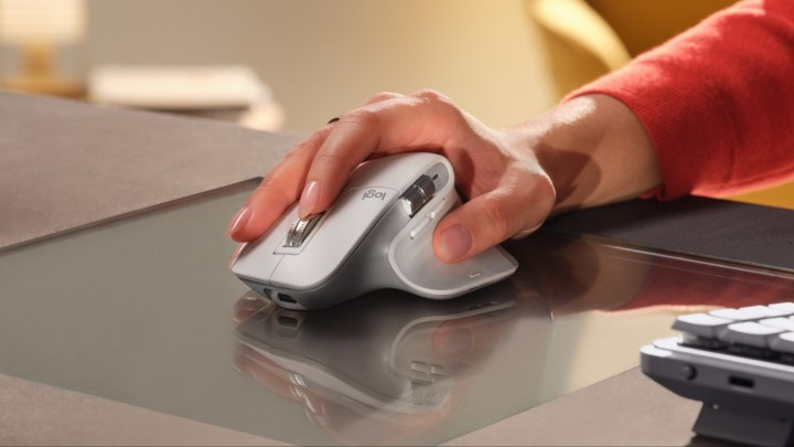 A person using the Logitech MX Master 3S for Mac mouse on a desk.