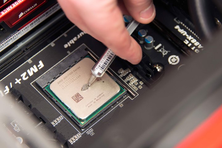 Thermal paste application on CPU.