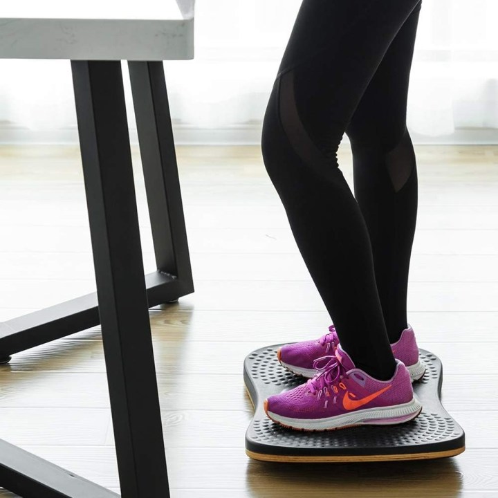 A person on the StrongTek balance board.