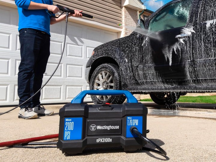 A man washes his truck with the Westinghouse ePX3100v Electric Pressure Washer.