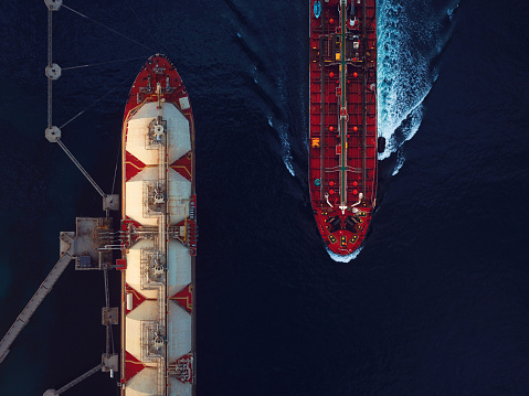 Aerial view of a liquified natural gas tanker and a crude oil tanker.