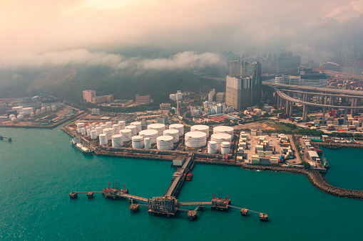 Aerial view Oil storage warehouse or Oil loading dock on the sea.