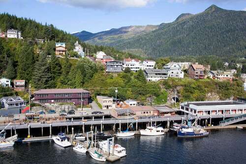 An aerial view of the town of Ketchikan, Alaska, with Deer Mountain in the background.