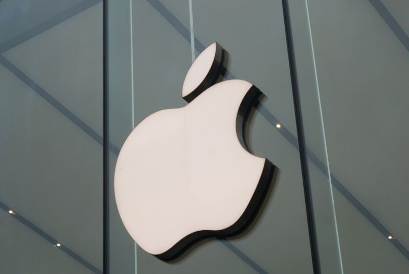 A large Apple logo seen on the outside of an Apple Store.