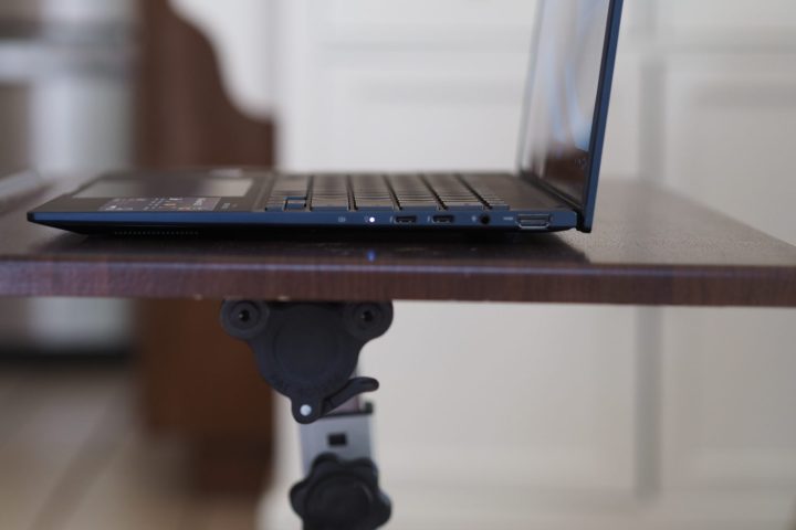 Asus Zenbook 14 OLED 2024 side view showing lid and ports.