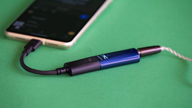 The AudioQuest DragonFly Cobalt connected to a phone and headphones.