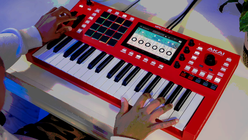 A pair of hands playing the keyboard. 