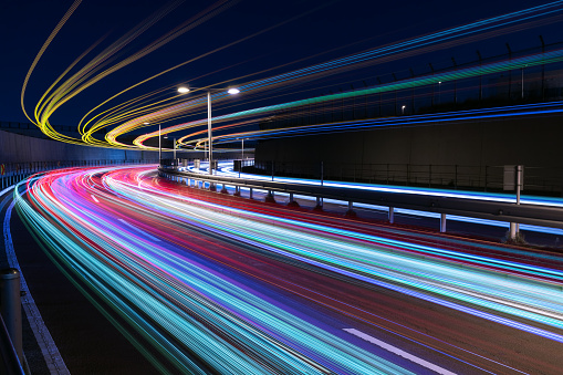 Colorful Light Trails Over A Curved Road