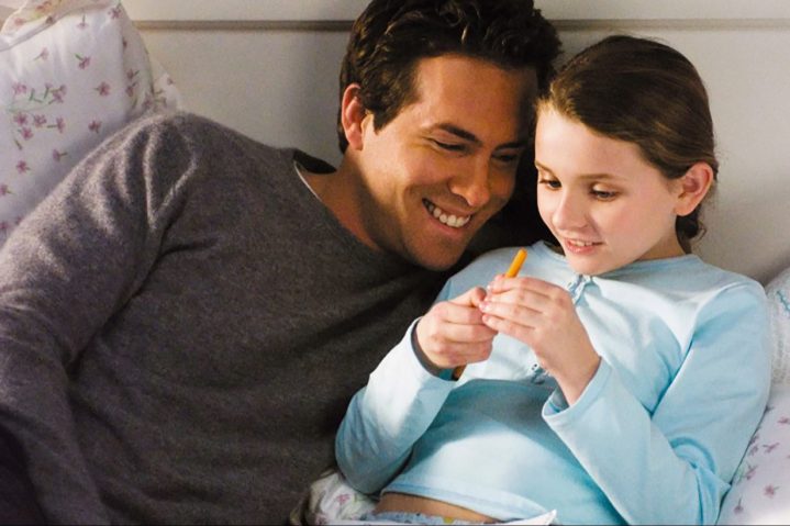 Ryan Reynolds cuddles up next to his young daughter.