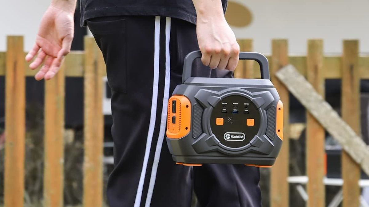 FLASHFISH 320W Portable Power Station carried by person