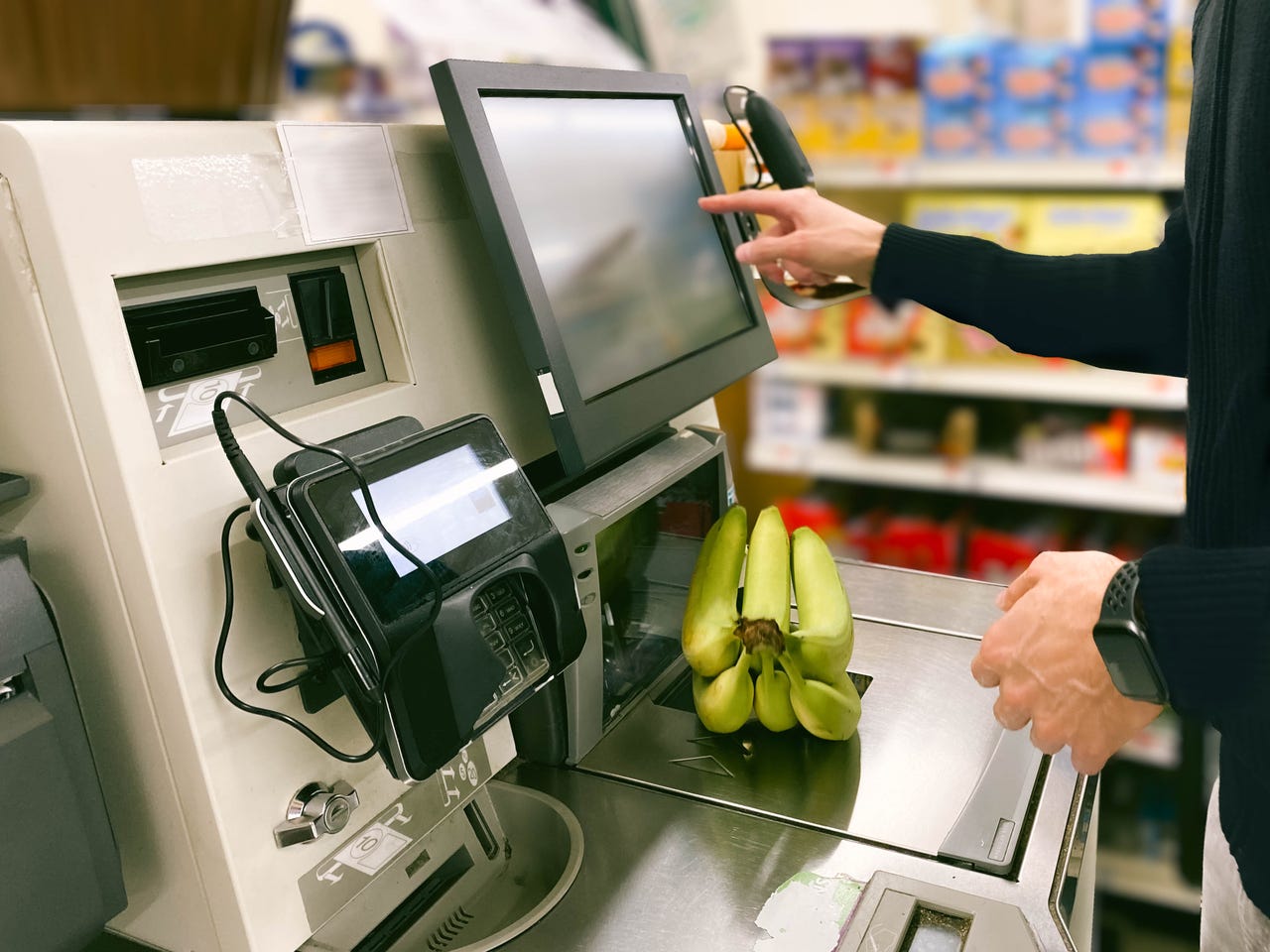 Person checking out bananas