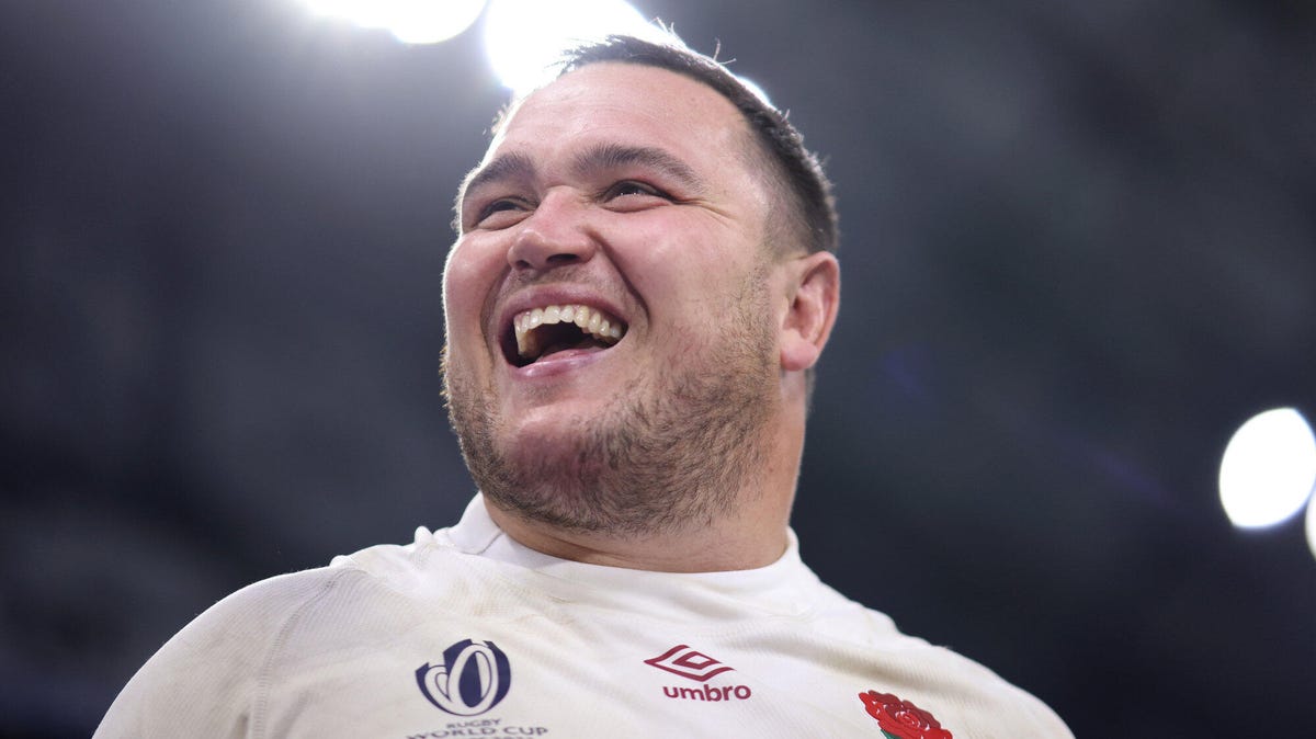 England rugby captain Jamie George smiling looking to his right.