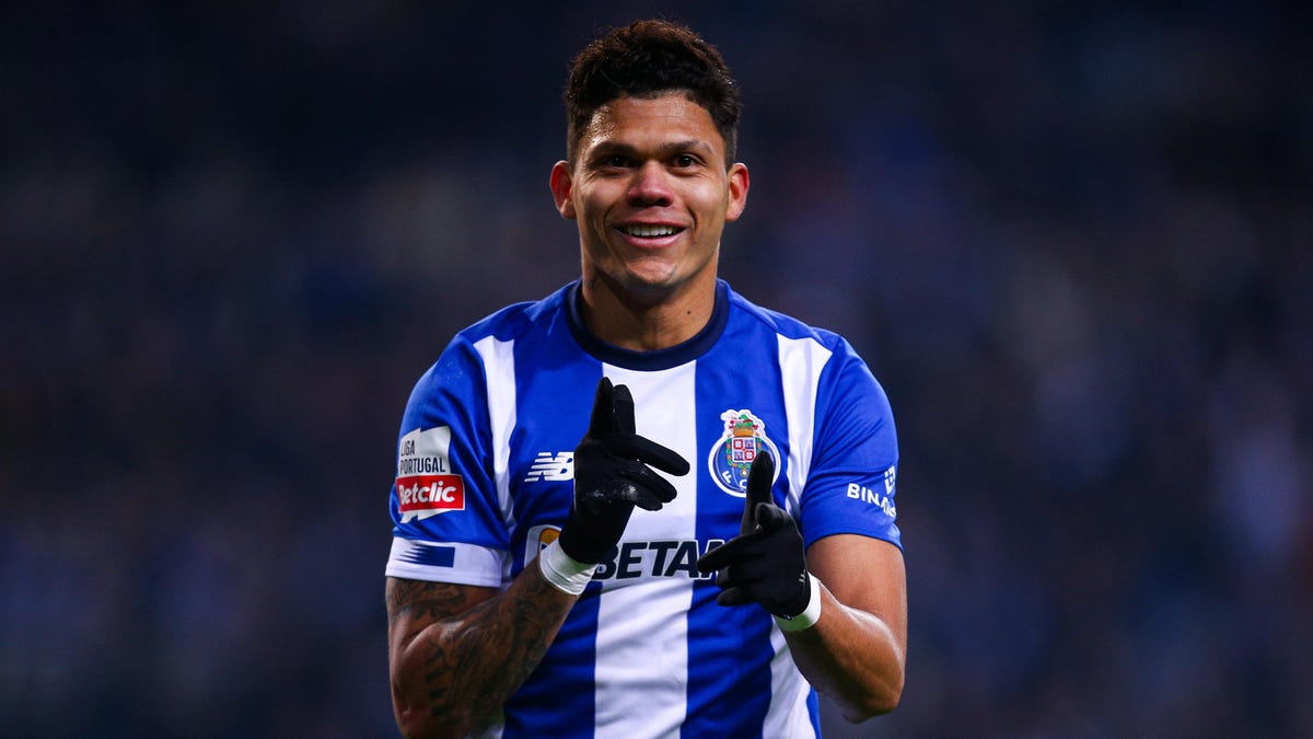 Evanilson of FC Porto celebrating, pointing, smiling.