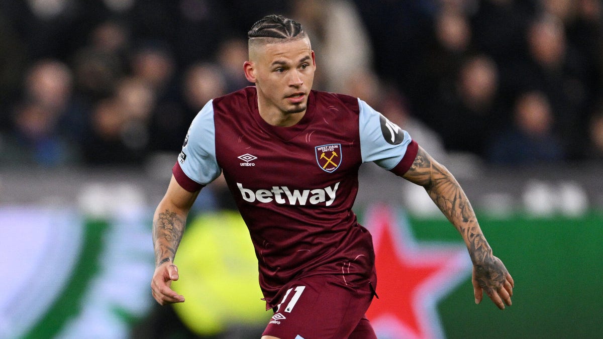 West Ham midfielder Kalvin Phillips, running, looking downwards to his left.