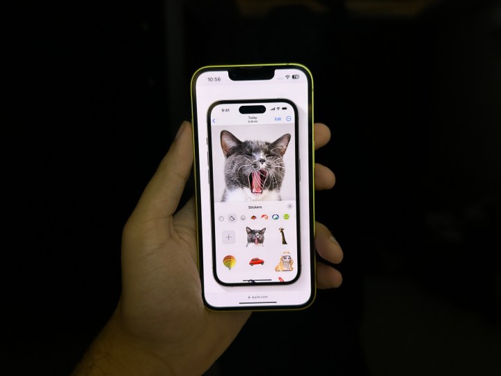 An iPhone with iOS 17, showing custom stickers in iMessage.