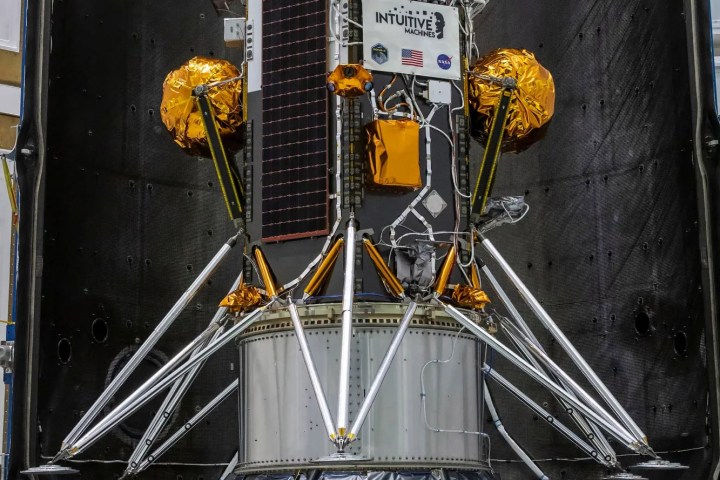 The Nova-C lunar lander is encapsulated within the fairing of a SpaceX Falcon 9 rocket in preparation for launch, as part of NASA’s CLPS (Commercial Lunar Payload Services) initiative and Artemis campaign.