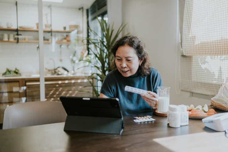 Telemedicine of senior woman consulting with her doctor on video conference.