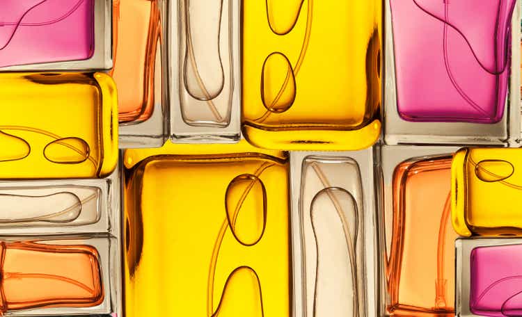 Top view, flat lay of a set of perfume bottles on a colorful background.