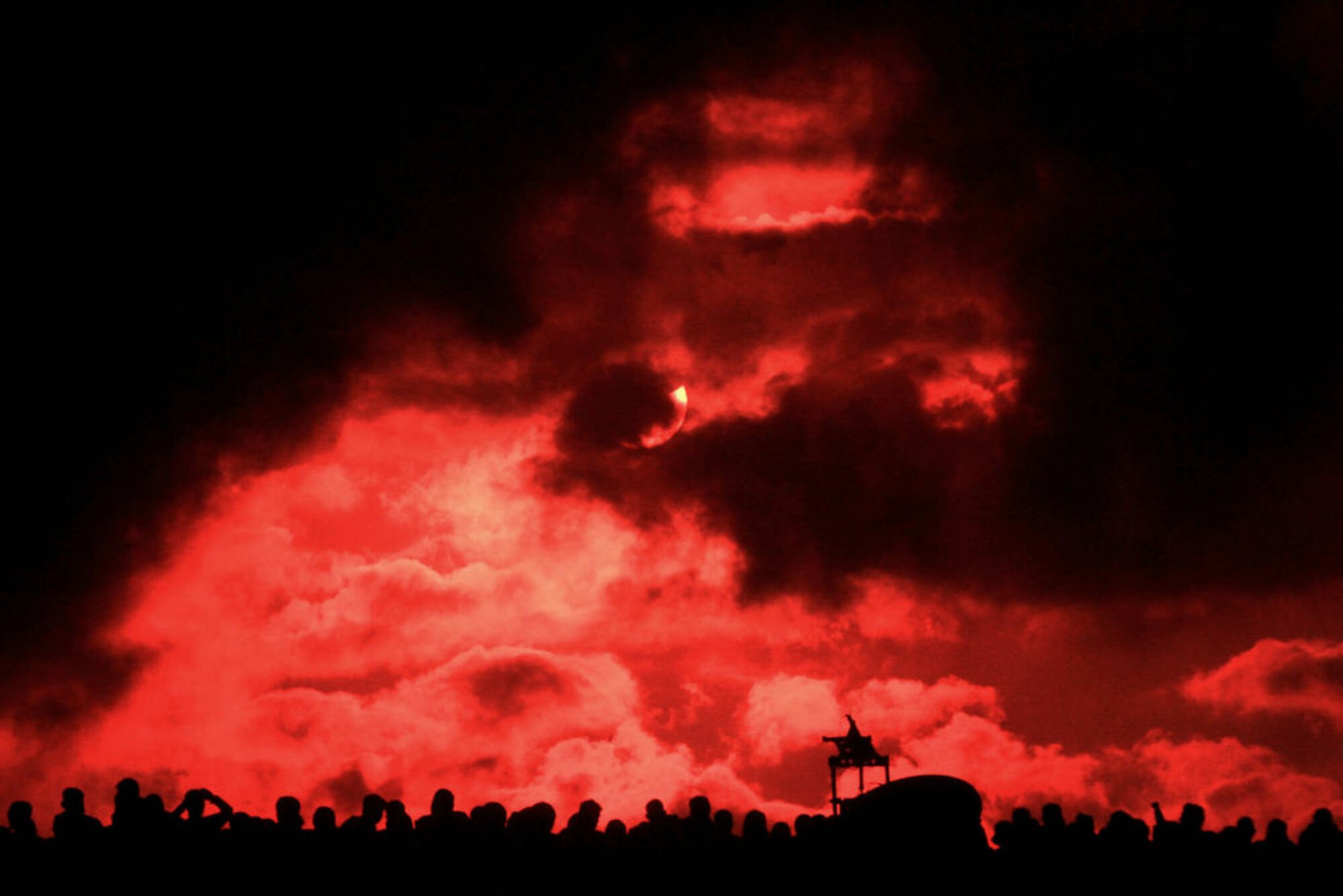 Bystanders watching a total solar eclipse in Indonesia in 2016