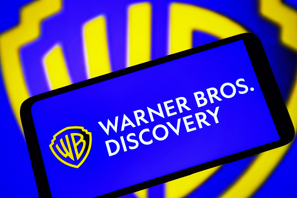 In this photo illustration, a Warner Bros. Discovery, Inc. (...