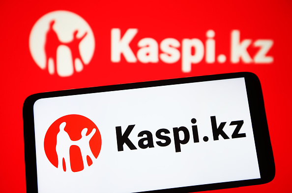 In this photo illustration, Kaspi.kz logo is seen on a...