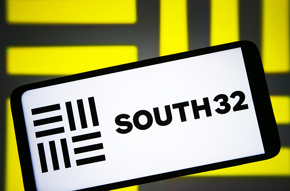 In this photo illustration, South32 logo is seen on a...