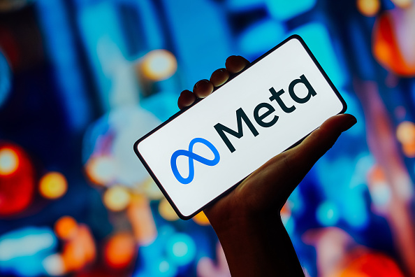 In this photo illustration, the Meta Platforms logo is...