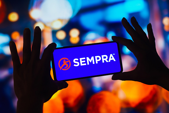 In this photo illustration, the Sempra Energy logo is...