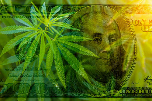 Legalization of marijuana. Cannabis leaf on the background of 100 dollar bill