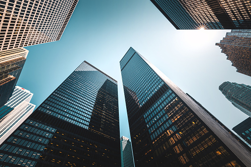 Low angle view of sunlight and skyscrapers in the financial district