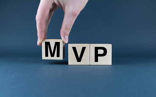 Minimum viable product MVP. Cubes form words Minimum viable product MVP.