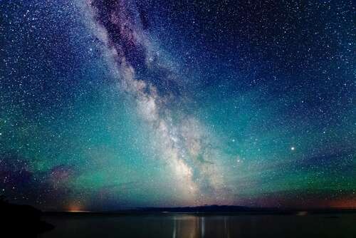 The milky way over Lake Superior with air glow and aurora borealis luminescence, taken in Grand Portage, Minnesota.