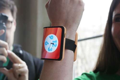 Someone wearing Motorola's concept folding phone on their wrist.