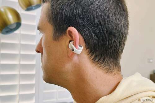 person wearing Bose Ultra Open Earbuds