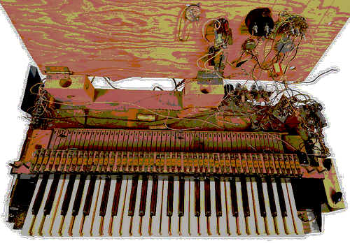 Photo of a musical keyboard attached to tangled wires and electronics mounted on plywood.