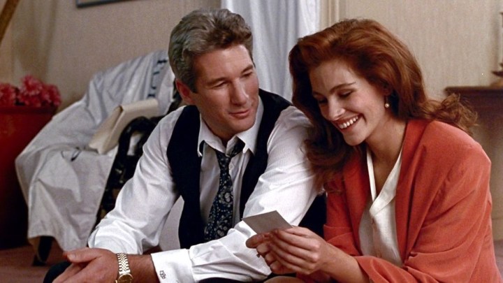 Richard Gere smiles at Julia Roberts in Pretty Woman.