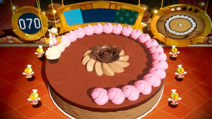 Princess Peach decorates a cake in Princess Peach: Showtime!