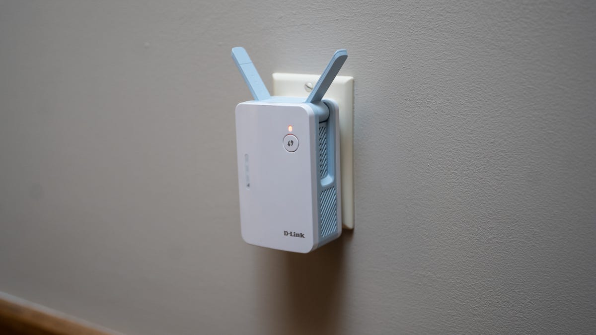 D-Link EaglePro AI range extender plugged into a wall.